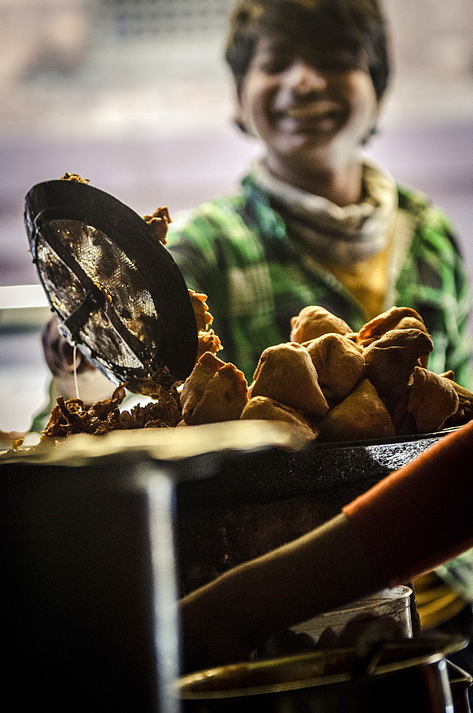 A young man prepares samosas, Bhaktapur, Nepal, Asia