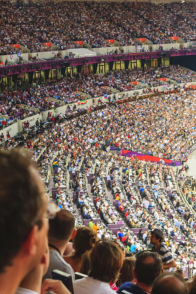 Spectators in a packed Olympic Stadium, including media area, London 2012, Summer Olympic Games, London, England, United Kingdom, Europe