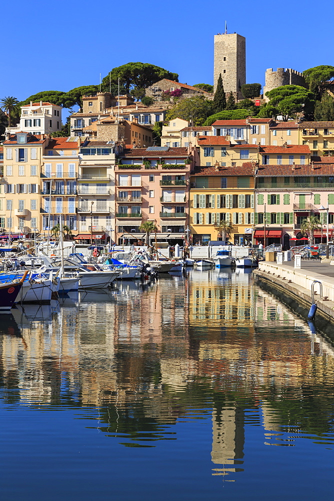 Reflections of boats and Le Suquet, Old (Vieux) port, Cannes, Cote d'Azur, Alpes Maritimes, Provence, France, Mediterranean, Europe