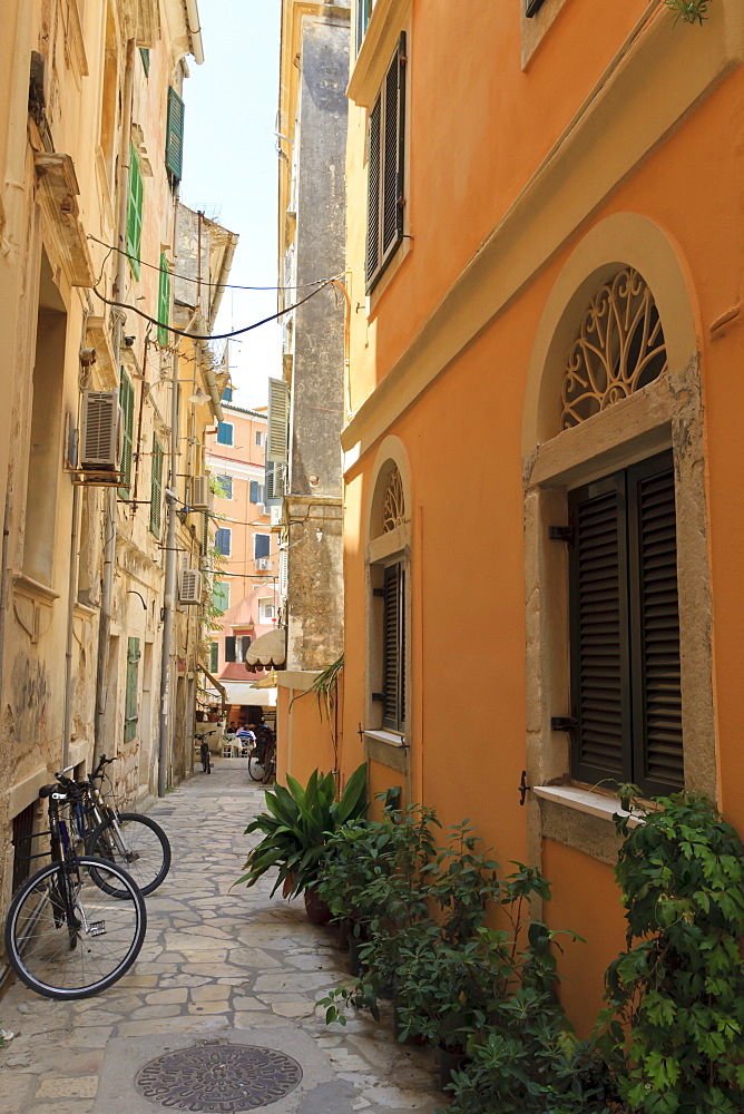 Narrow street with bike, Old Town, Corfu Town, Corfu, Ionian Islands, Greece