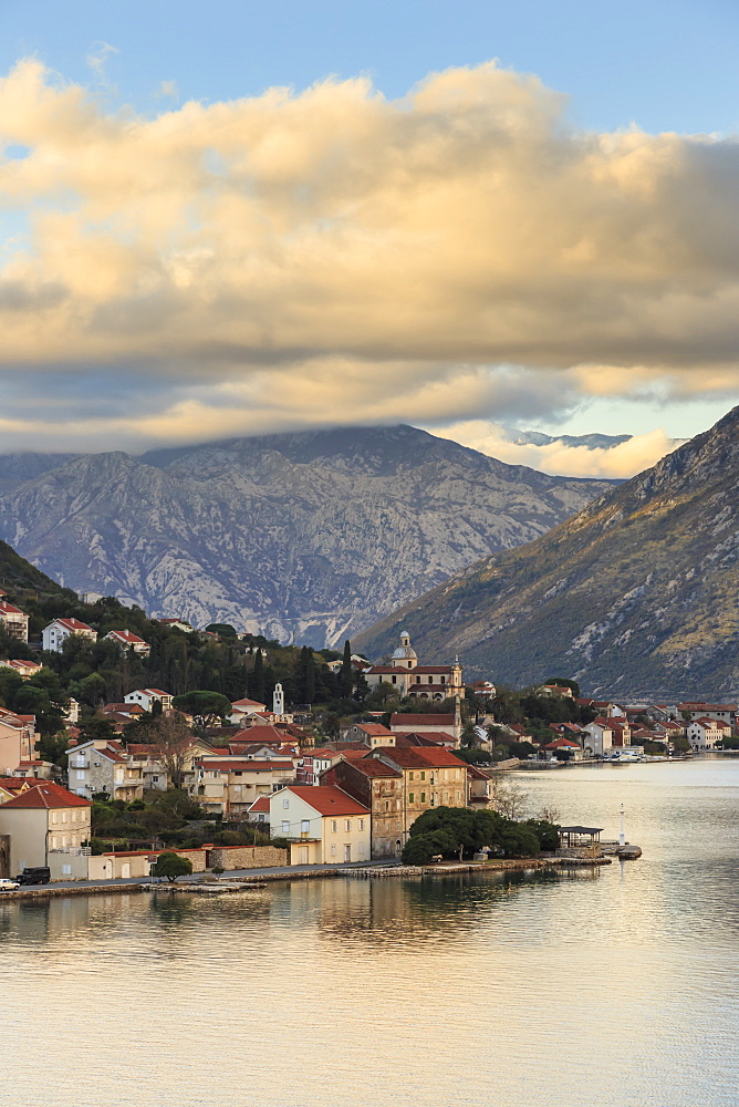 Town on the shores of the stunningly beautiful Bay of Kotor (Boka Kotorska) at sunset, UNESCO World Heritage Site, Montenegro, Europe