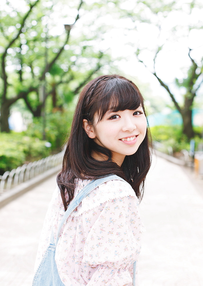 Portrait of a Japanese girl smiling while looking at camera