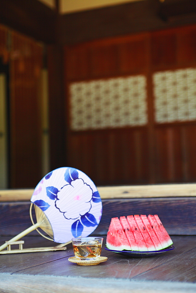 Sliced Watermelon And Paper Fan