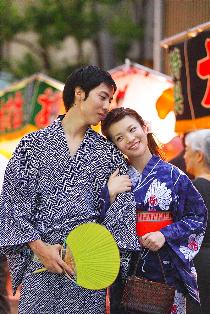 Young Japanese Couple Wearing Yukata at Summer Festival