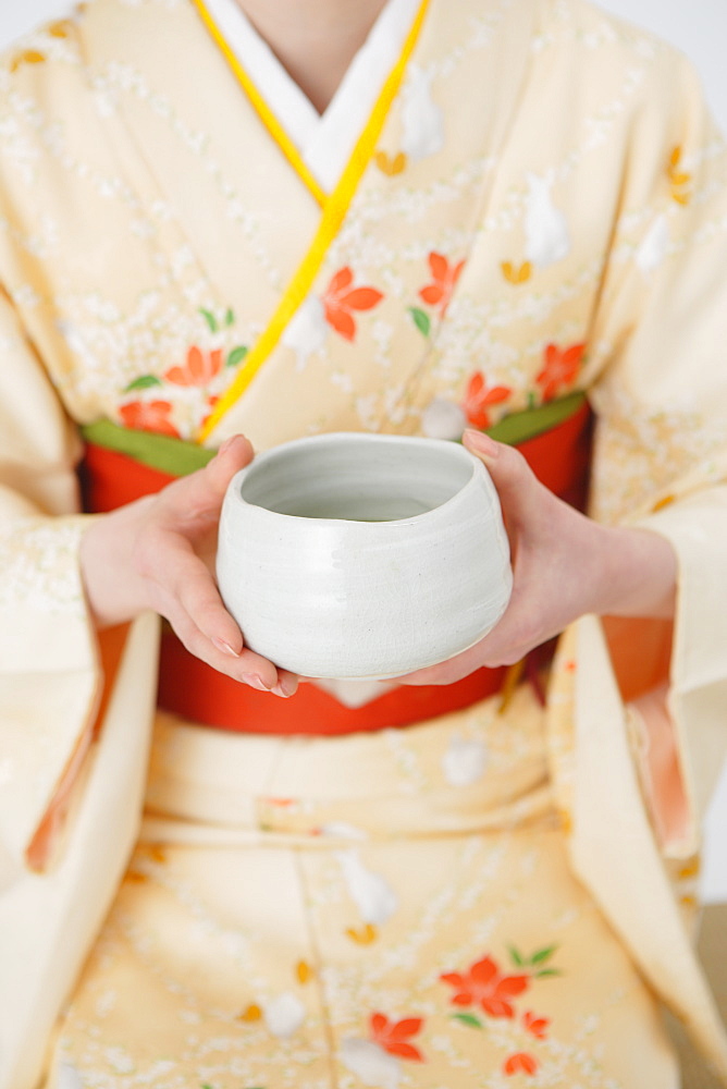 Woman Holding Tea Bowl