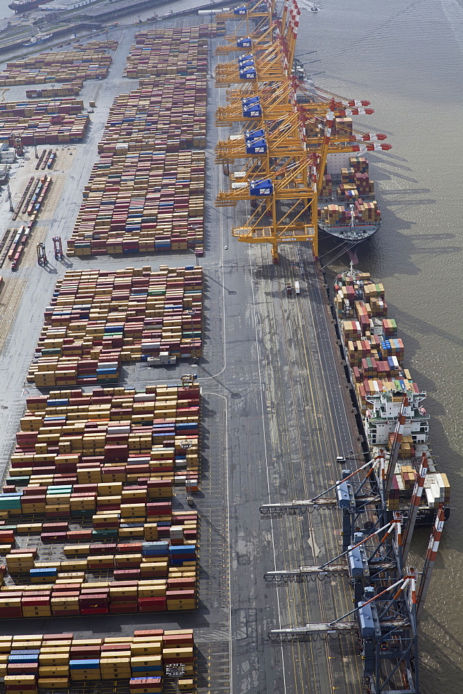 Elevated view of cargo containers and boat at port in Bremerhaven, Bremen, Germany