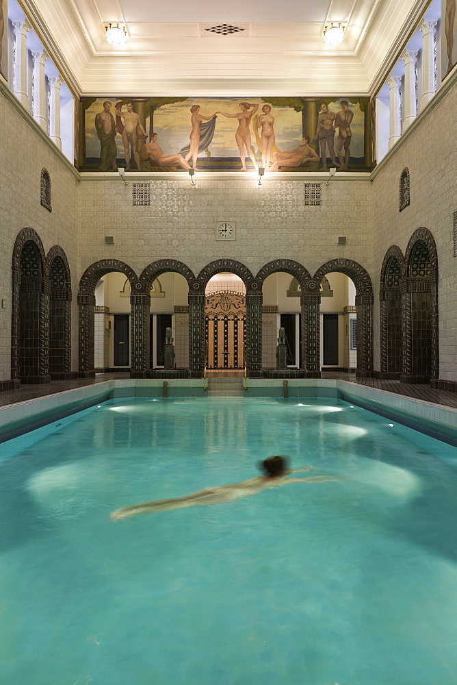 Woman swimming in Emperor Frederick swimming pool, Wiesbaden, Hesse, Germany