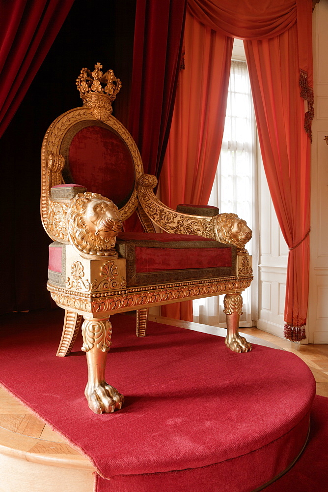 Red chair in Throne room at Weissensteinflugel Museum, Kassel, Hesse, Germany