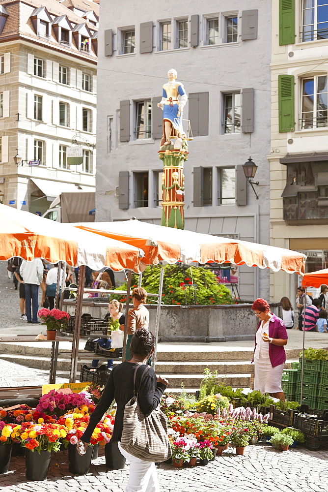 Market place with justice fountain at Place de la Palud, Lausanne, Switzerland