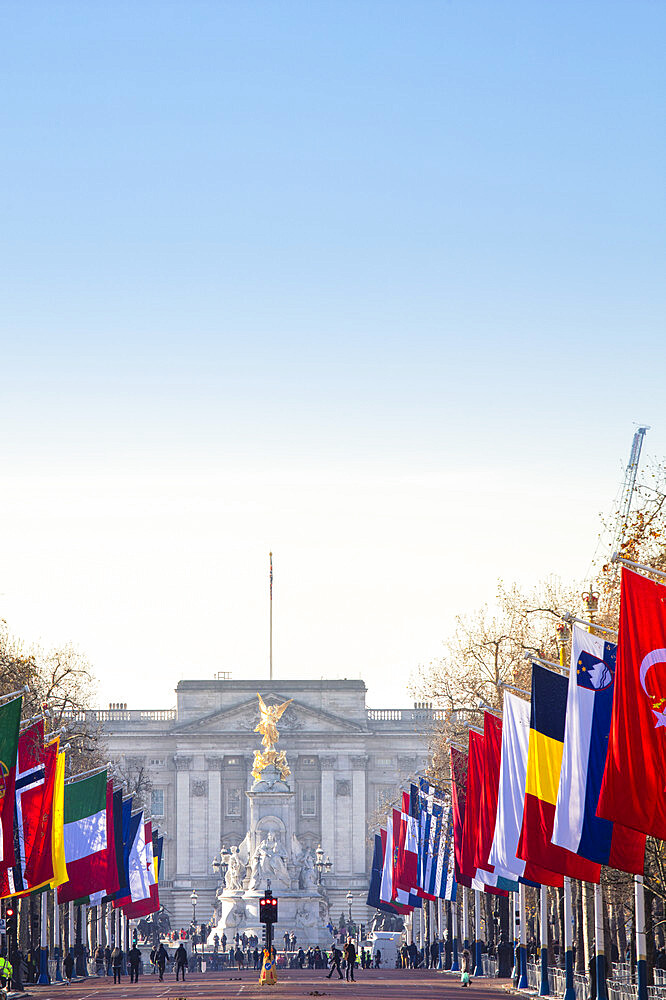 View of Buckingham Palace and The Mall lined with flags, London, England, United Kingdom, Europe