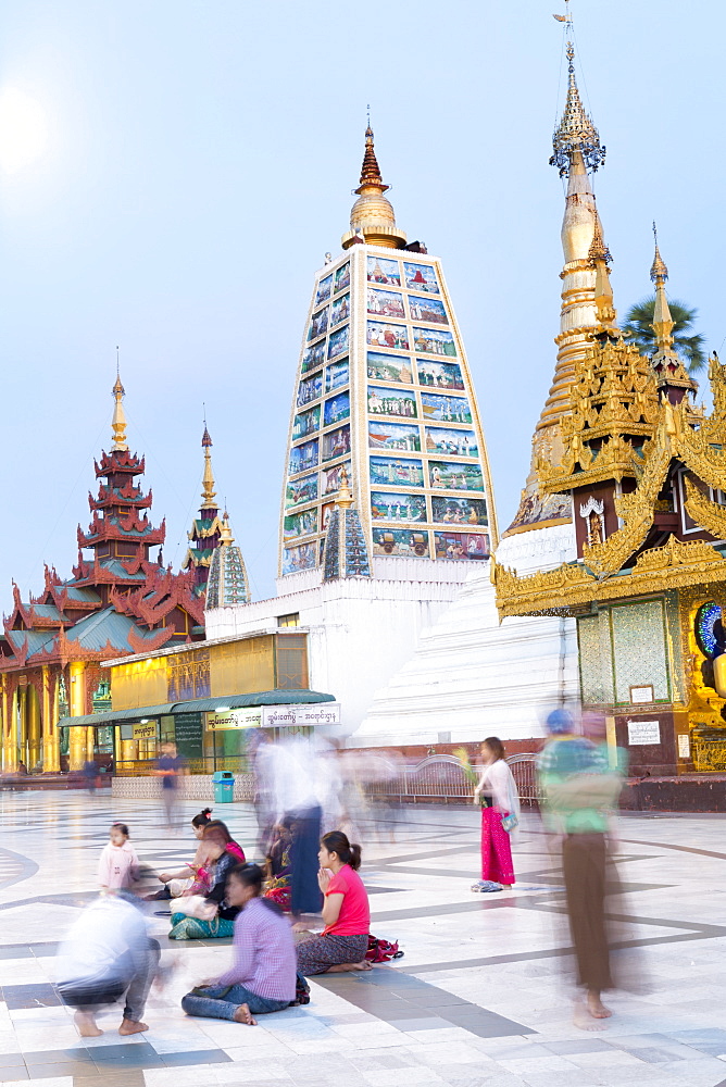 Devotees paying obeisance at the Shwedagon pagoda complex in Yangon (Rangoon), Myanmar (Burma), Southeast Asia