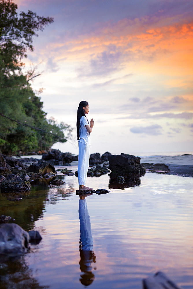 Cambodian woman standing in a yoga asana, Sihanoukville, Cambodia, Indochina, Southeast Asia, Asia