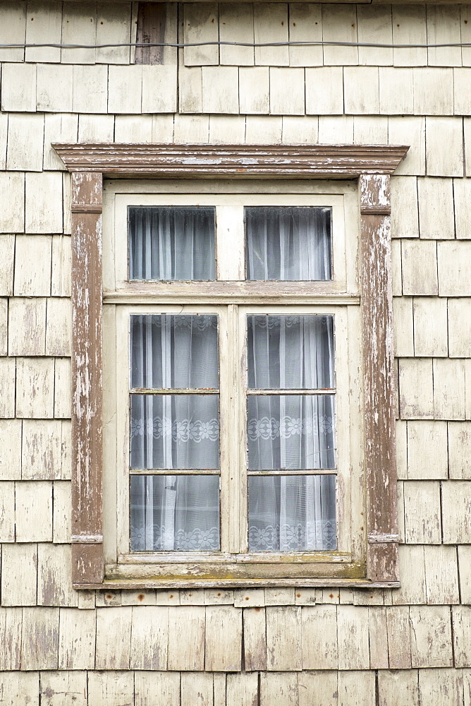 Distinctive wooden tiles around a window in Chiloe Island, Northern Patagonia, Chile, South America