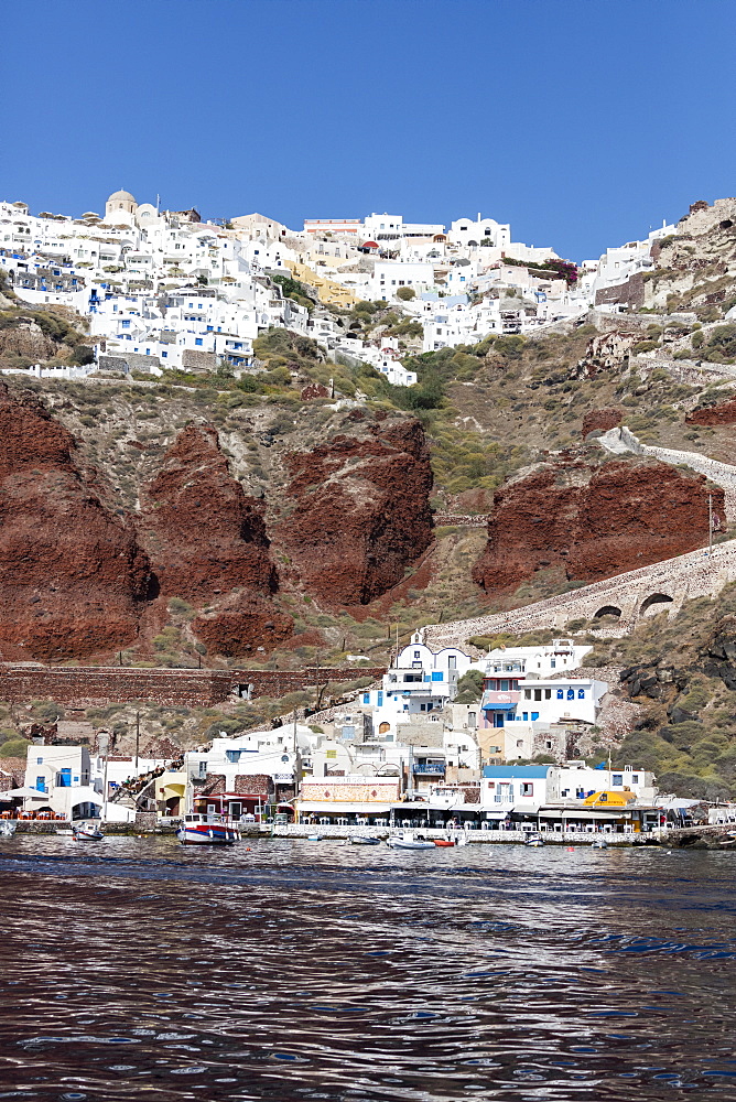 Typical Greek village perched on volcanic rock with white and blue houses and windmills, Santorini, Cyclades, Greek Islands, Greece, Europe