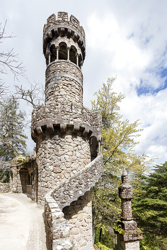 Old mystical tower of Romanesque Gothic and Renaissance style inside the park Quinta da Regaleira, Sintra, Portugal, Europe