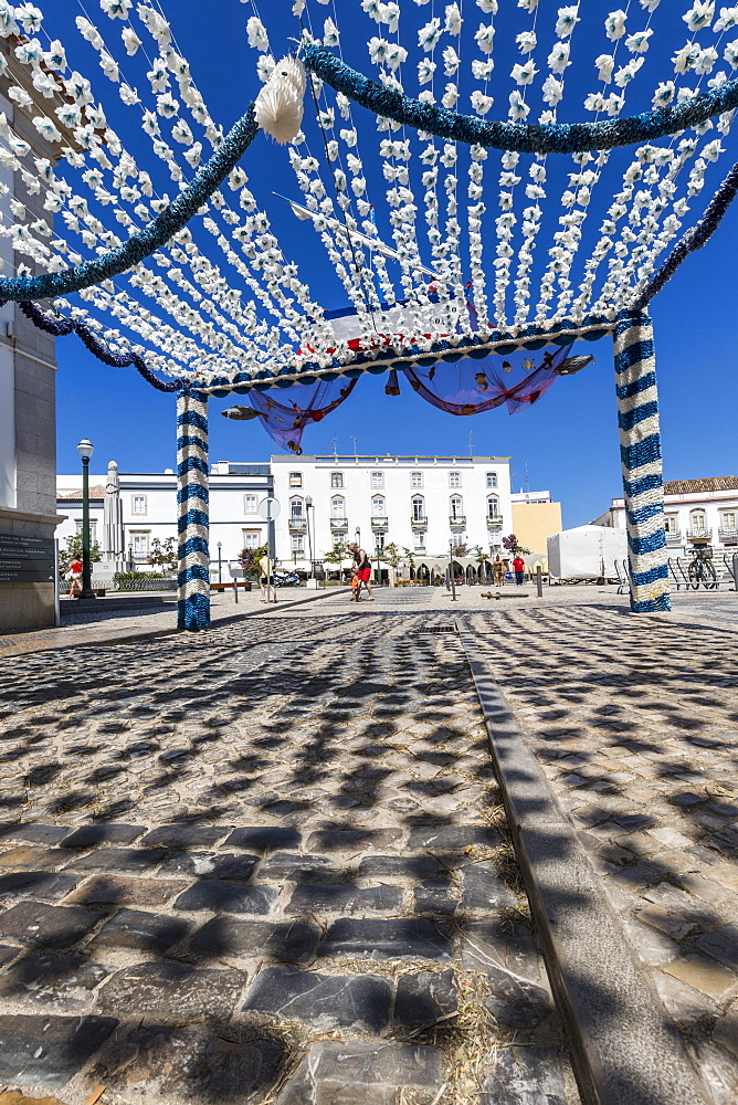 Colors and decoration in the pedestrian centre of Tavira on a sunny summer day, Faro, Algarve, Portugal, Europe