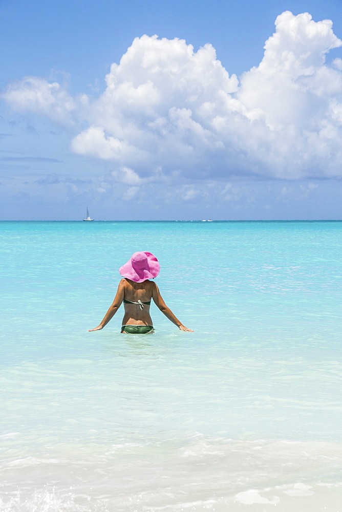 Bather in the turquoise waters of the Caribbean Sea, Jolly Beach, Antigua, Antigua and Barbuda, Leeward Islands, West Indies, Caribbean, Central America