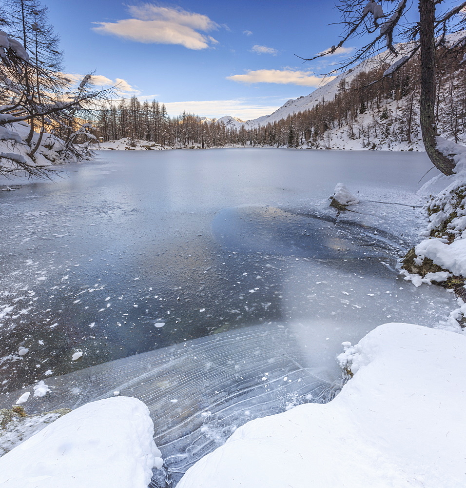 Panorama of frozen Lago Azzurro at dawn, Spluga Valley, Province of Sondrio, Valtellina, Lombardy, Italy, Europe