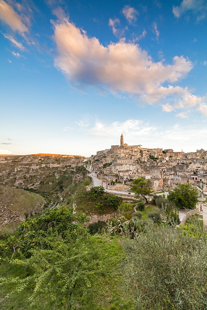 Sunset on the ancient town and historical center called Sassi, perched on rocks on top of hill, Matera, Basilicata, Italy, Europe