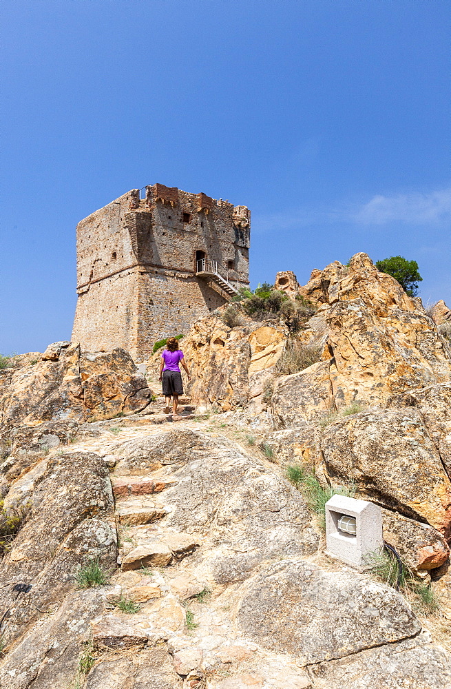 Genoese tower of granite rocks built as fortress of defense framed by blue sky, Porto, Southern Corsica, France, Mediterranean, Europe