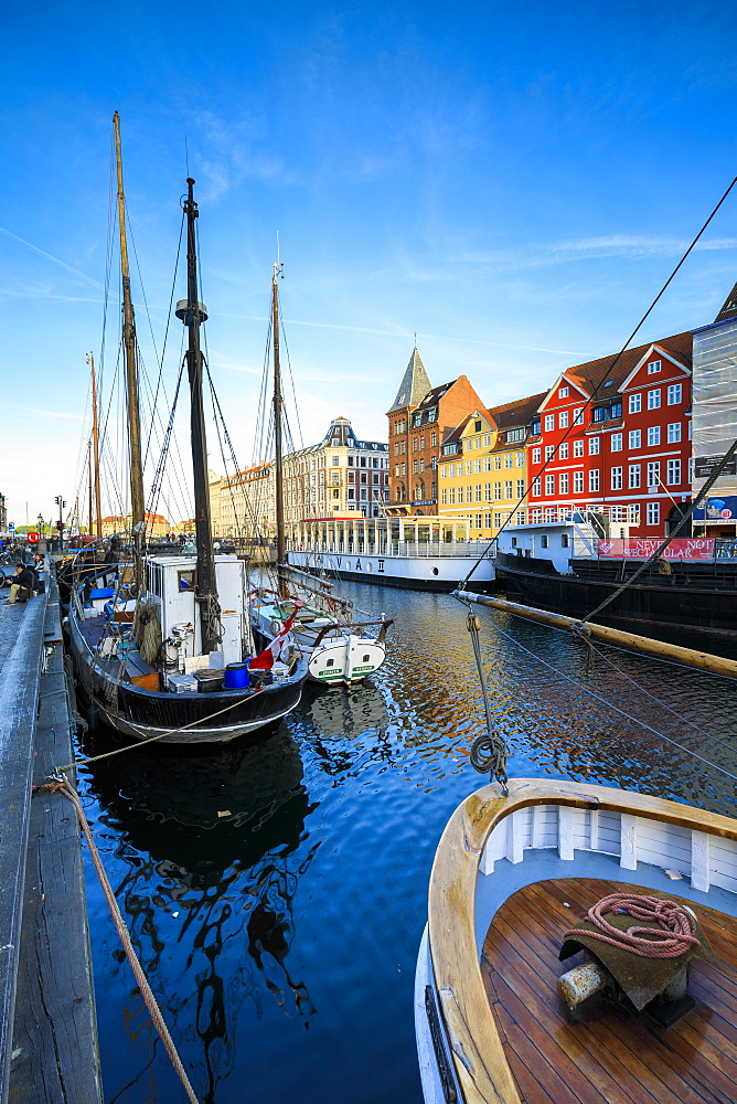 Boats in Christianshavn Canal with typical colorful houses in the background, Copenhagen, Denmark, Europe