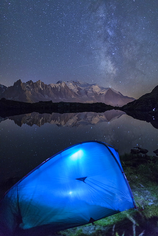 Camping with a tent under the Milky Way at Lac des Cheserys, looking at Mont Blanc, Haute Savoie, French Alps, France, Europe