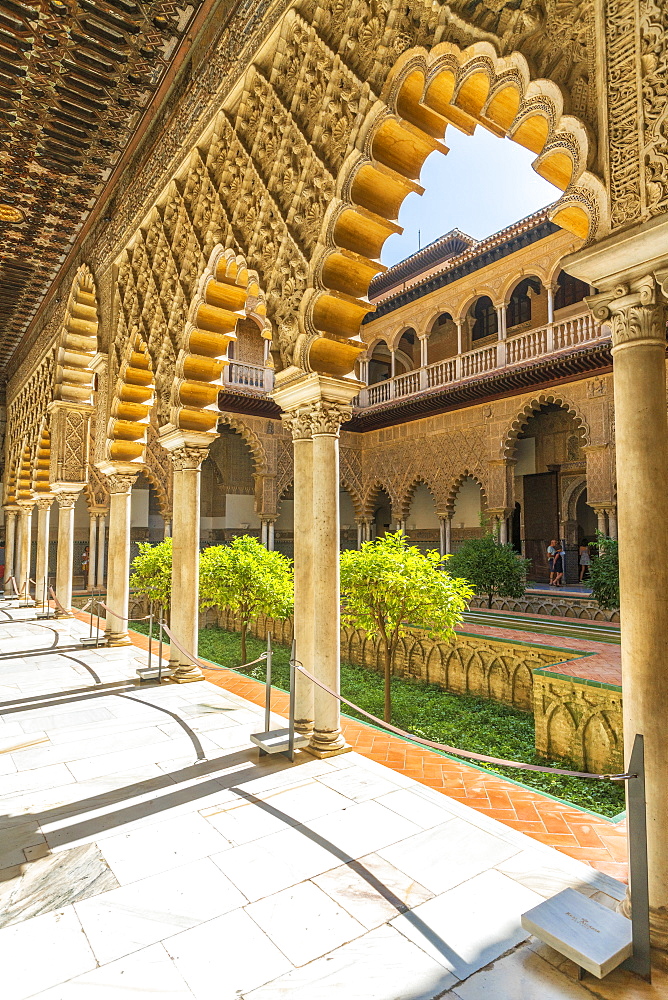 Decorated pillars and archways on side of courtyard of the Patio de las Doncellas, Real Alcazar, UNESCO World Heritage Site, Seville, Andalusia, Spain, Europe