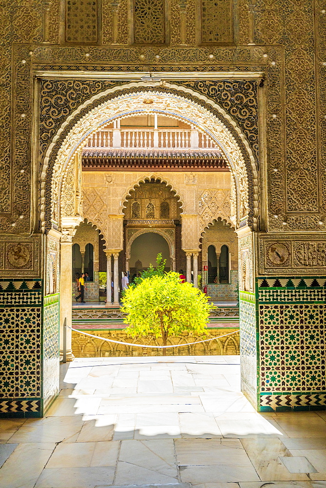 Patio de las Doncellas from interior of room with arabic mosaic walls and archways, Real Alcazar, UNESCO World Heritage Site, Seville, Andalusia, Spain, Europe