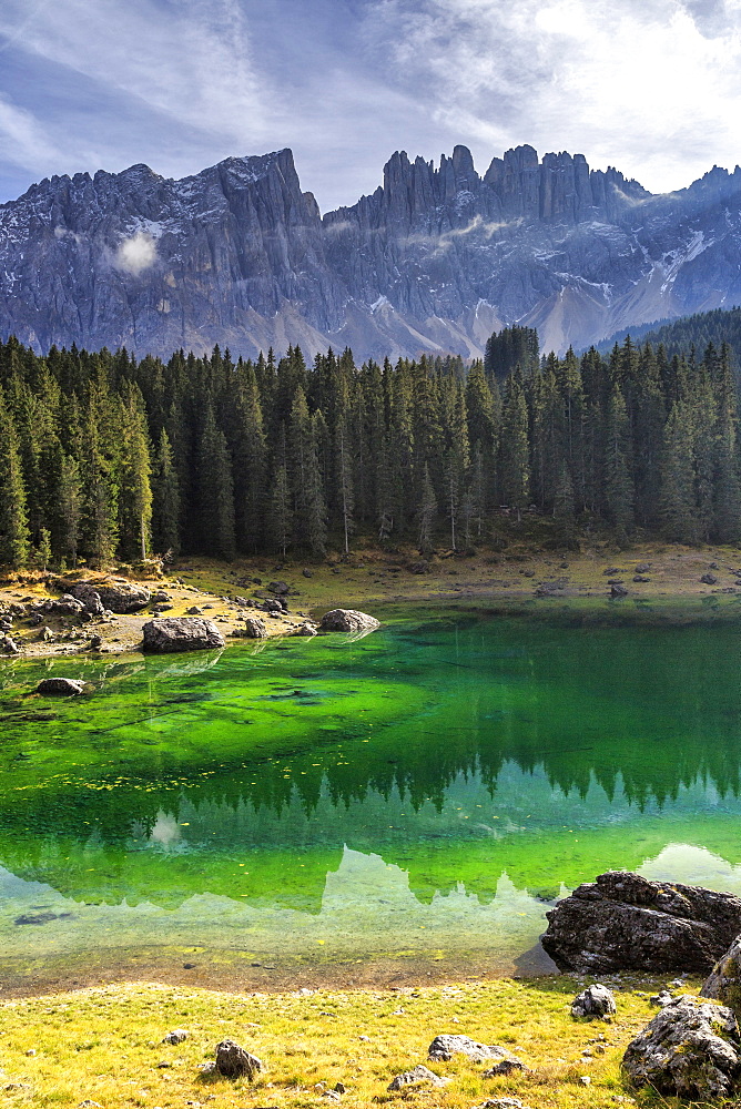 Latemar group reflected in the green waters of Lake Carezza, Ega Valley, South Tyrol Trentino-Alto Adige, Dolomites, Italy, Europe