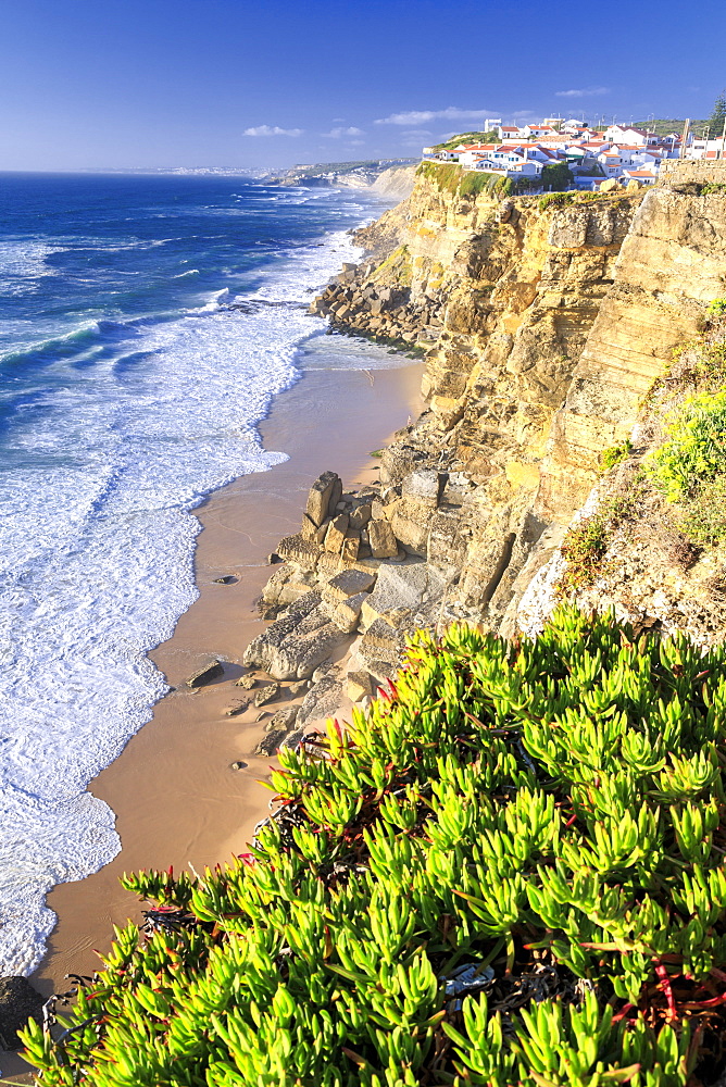 Top view of ocean waves crashing on the high cliffs of Azenhas do Mar, Sintra, Portugal, Europe