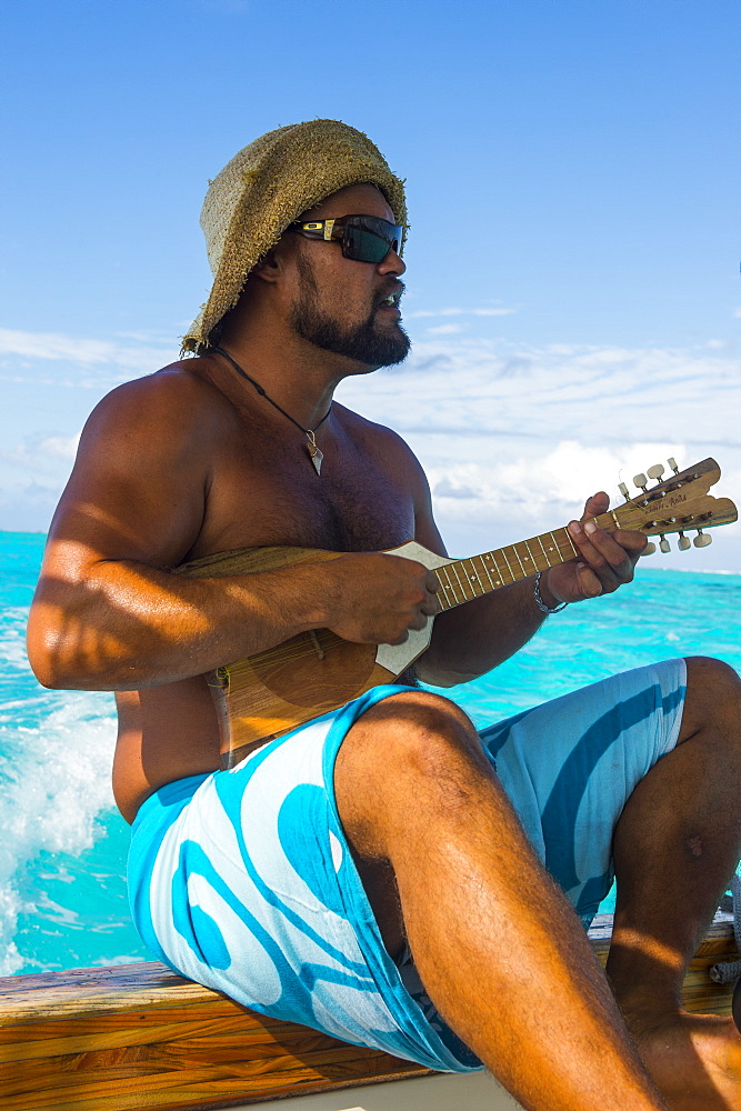 Local man playing the Ukulele, Bora Bora, Society Islands, French Polynesia, Pacific