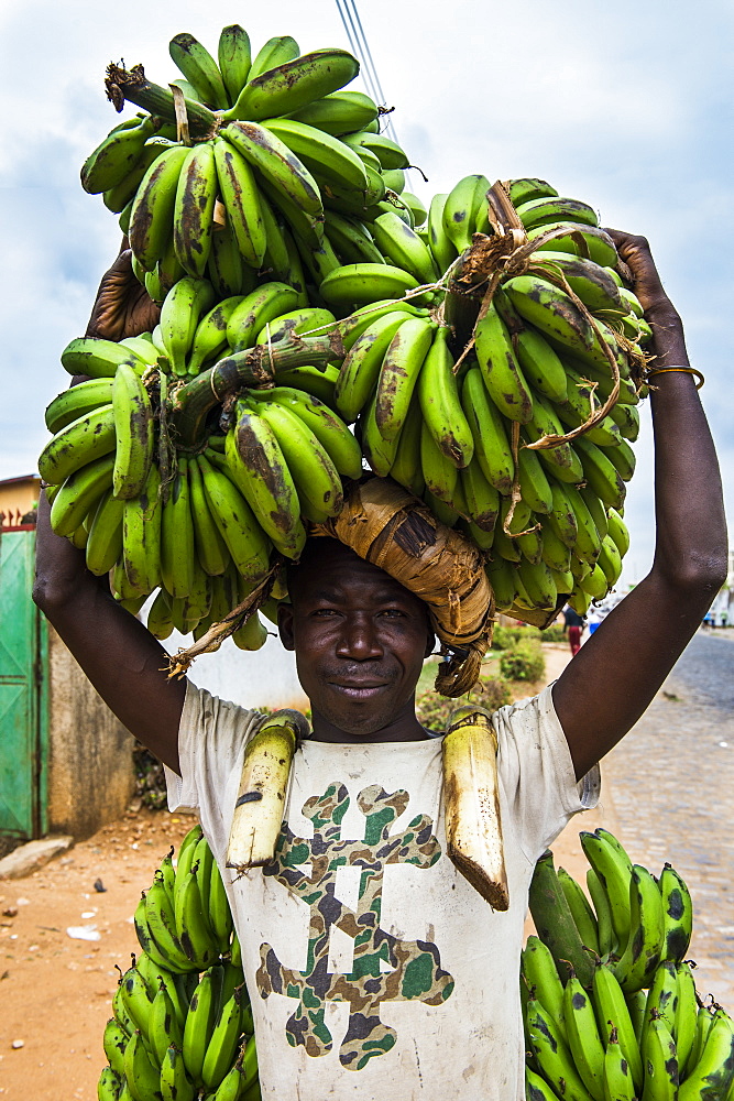 Man carrying lots of bananas on his head, Bujumbura, Burundi, Africa