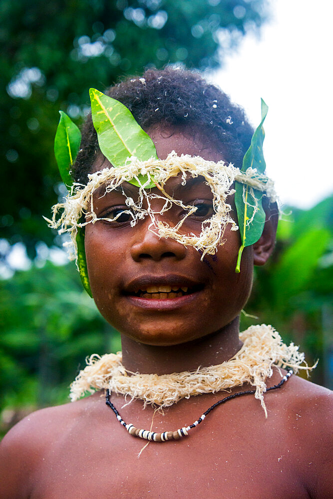 Traditional dressed boy in a war ceremony, Manus Island, Admiralty Islands, Papua New Guinea, Pacific