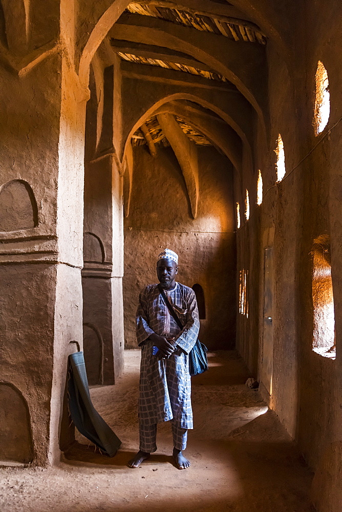 Imam praying in a beautiful Hausa style architecture Mosque in Yaama, Niger, West Africa, Africa