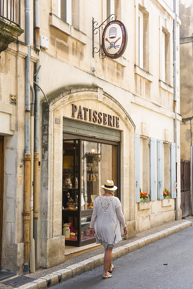 Woman walking through Martigues, Bouches du Rhone, Provence, Provence-Alpes-Cote d'Azur, France, Europe