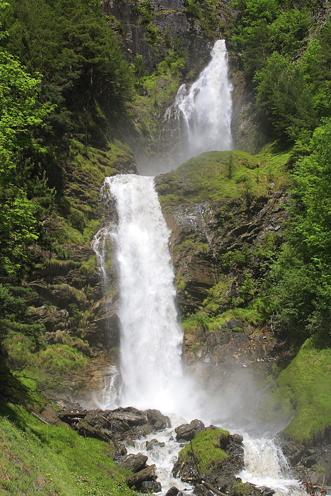 Swiss alps, mountain waterfall in spring time, bernese , meiringen, bern, switzreland