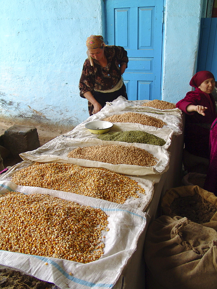 Uzbekistan woman selling corn, beans and lentils, shakhrisabz