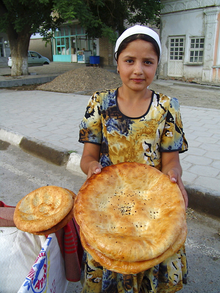 Uzbekistan girl selling bread, bukhara