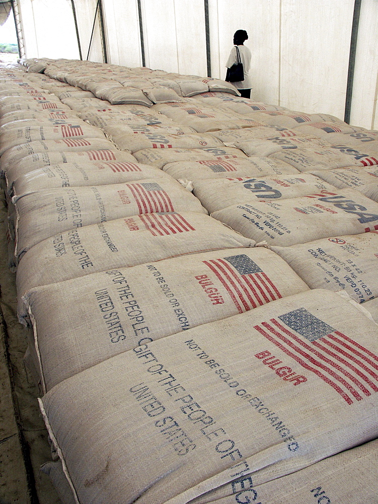 Zambia catholic relief services (crs) warehouse tent with american food aid ready for distribution in the drought stricken region of shangombo