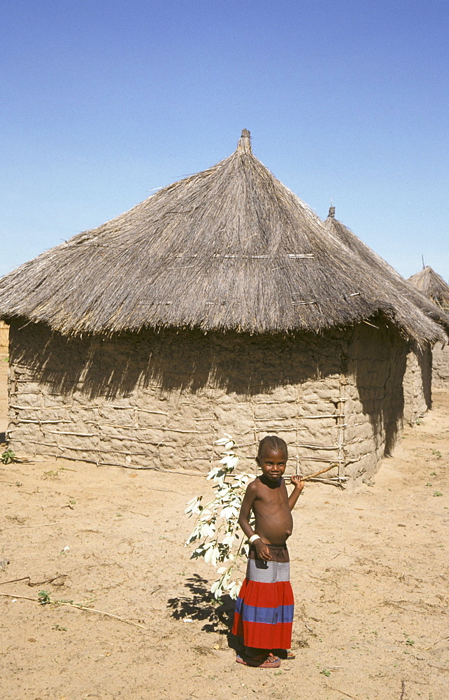 Zambia girl in front of her house, shangombo