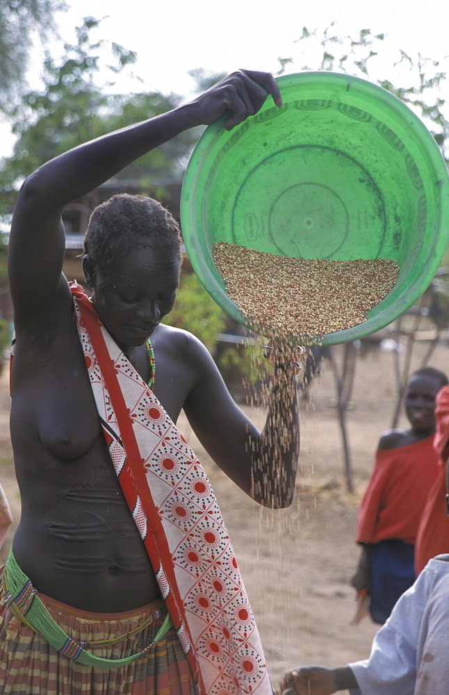 South sudan cleaning grain, toposa tribals at nanyangacor