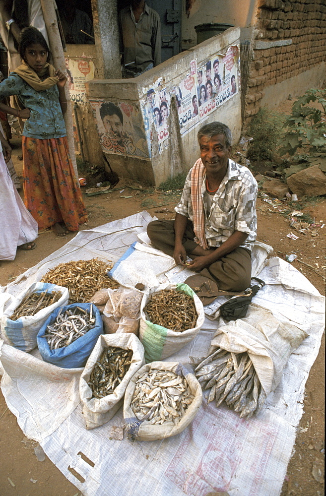 India man selling dried at a village market madurai, tamil