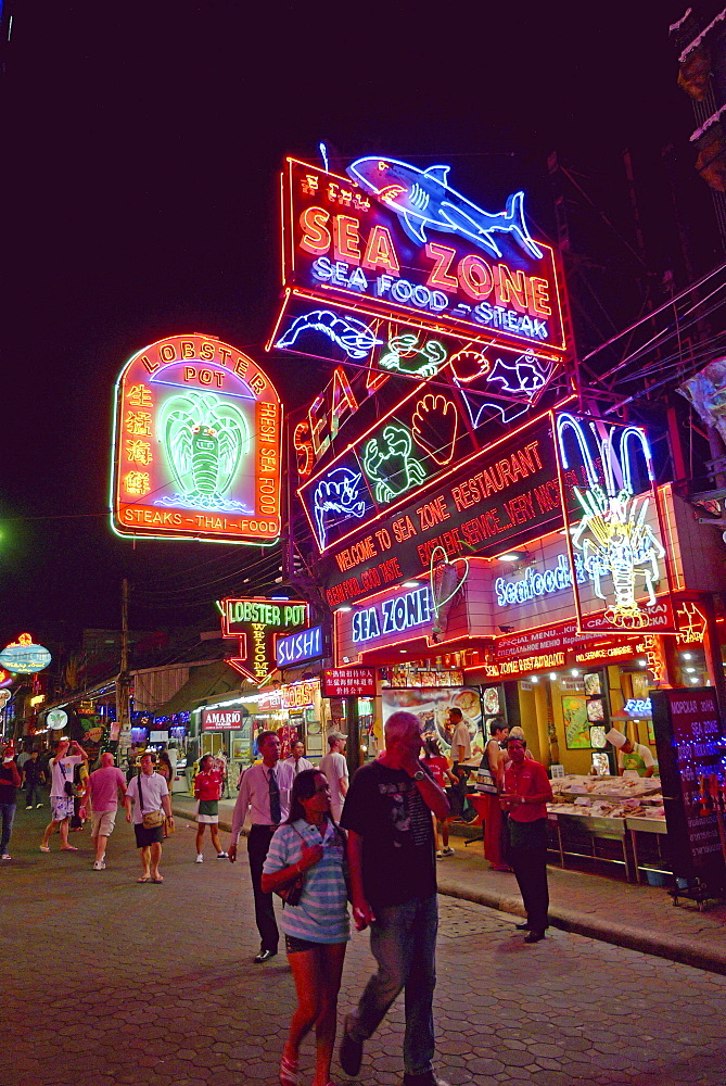 THAILAND Pattaya. Beach resort famous for night life and sex tourism. Walking street. Neon signs of sea food restaurants. Photo by Sean Sprague