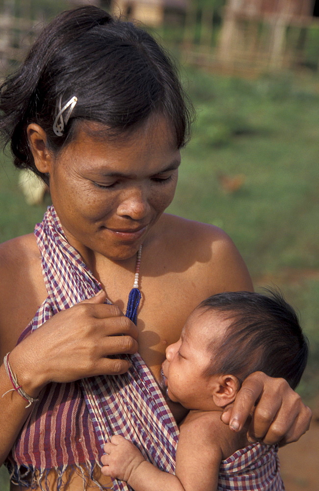 Cambodia kreung mother breastfeeding her child, malik village, ratanakiri