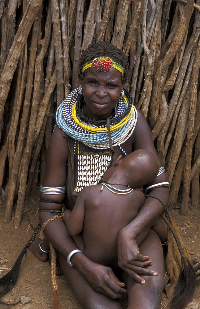 South sudan mother and child at community celebration at toposa tribal village of naboliyatom, nanyangacor.