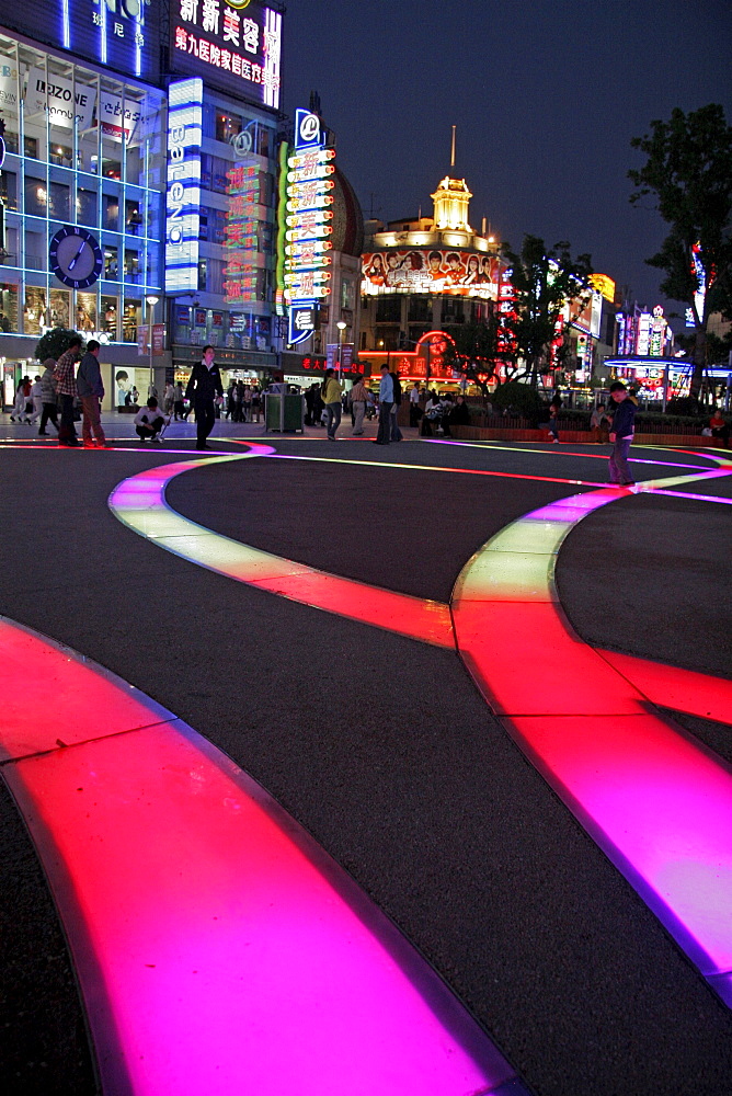 China nanjing road, one of the main shopping and tourist streets of shanghai. Neon signs.