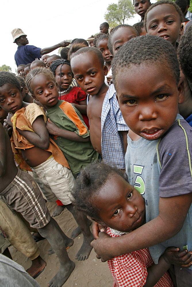 Namibia a feeding centre hungry children in rundu. Most of these children aids orphans, or positive themselves, or both. A catholic church organization provides them with a daily meal, perhaps only decent food they. hunger is evident in their eyes expressions