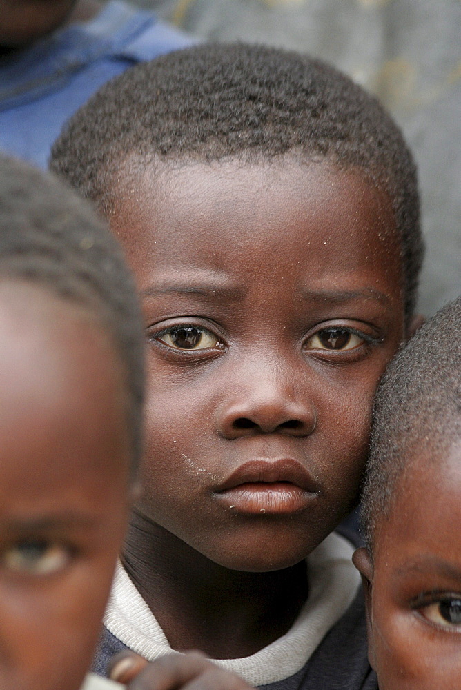 Namibia a feeding centre hungry children in rundu. Most of these children aids orphans, or positive themselves, or both. A catholic church organization provides them with a daily meal, perhaps only decent food they. hunger is evident in their eyes expressions