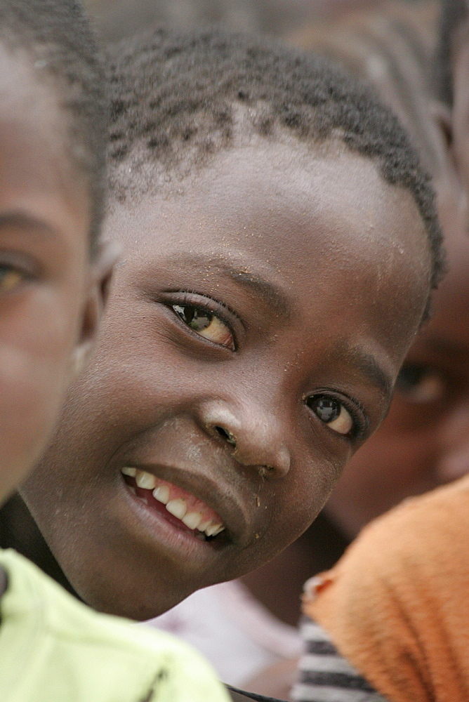 Namibia a feeding centre hungry children in rundu. Most of these children aids orphans, or positive themselves, or both. A catholic church organization provides them with a daily meal, perhaps only decent food they. hunger is evident in their eyes expressions