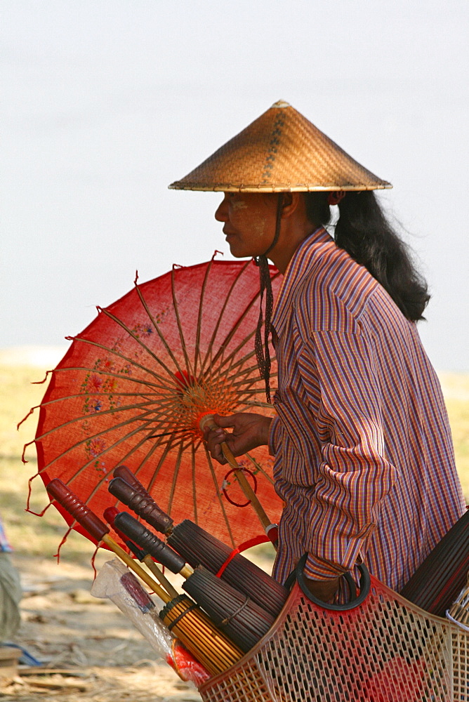 Myanmar woman selling umbrella/sunshades, mingun, near mandalay 